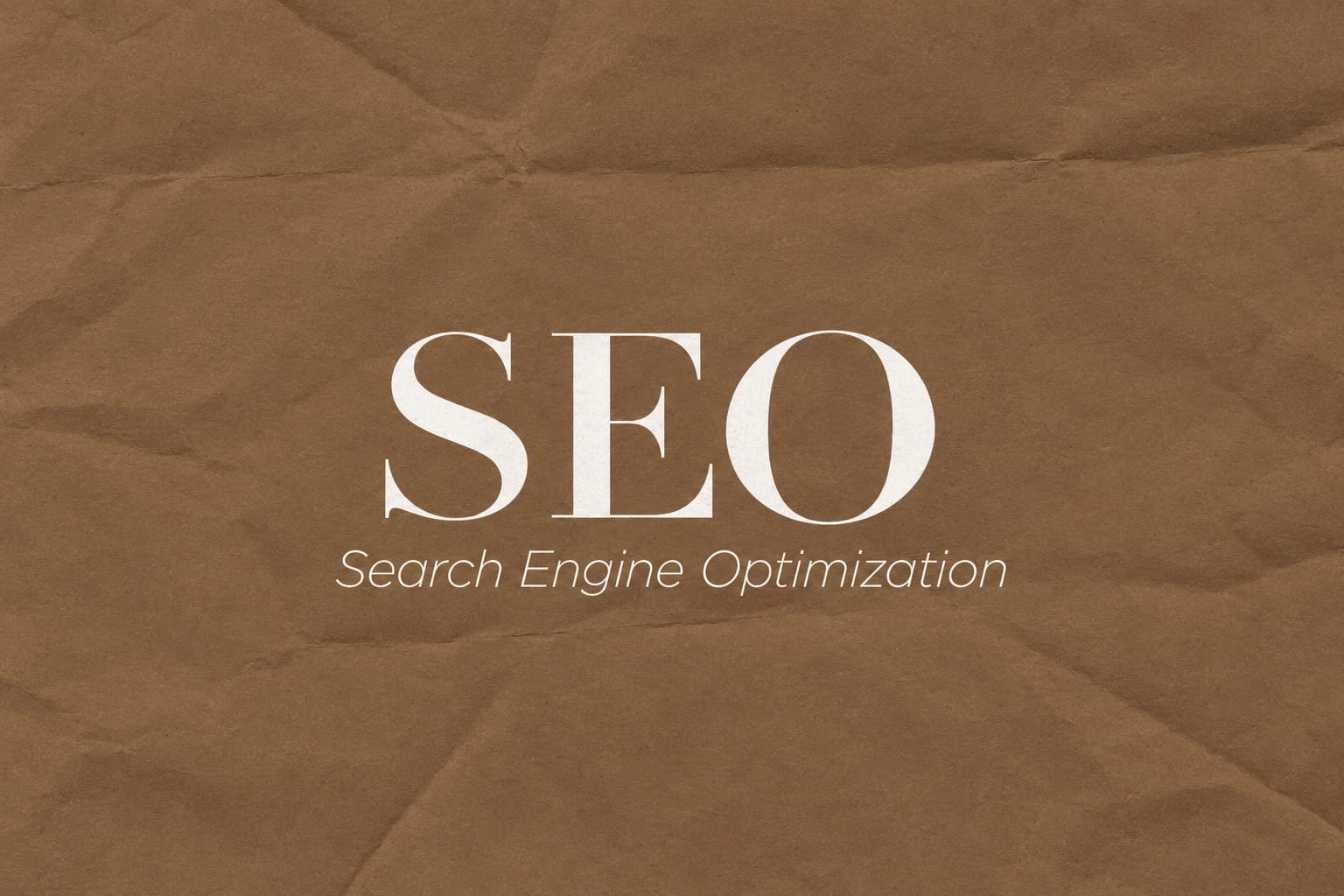 Large white text reading "SEO" and "Search Engine Optimization" displayed against a brown crinkled paper texture background.